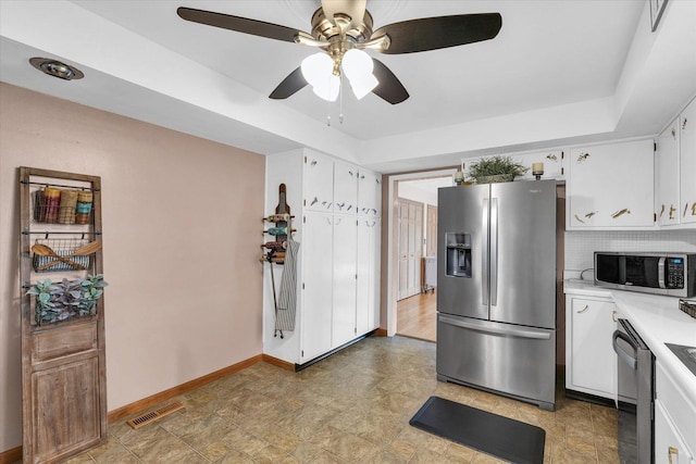 kitchen featuring stainless steel appliances, ceiling fan, visible vents, light countertops, and white cabinets
