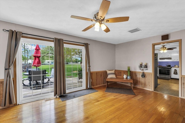 sitting room featuring ceiling fan, wood-type flooring, and visible vents