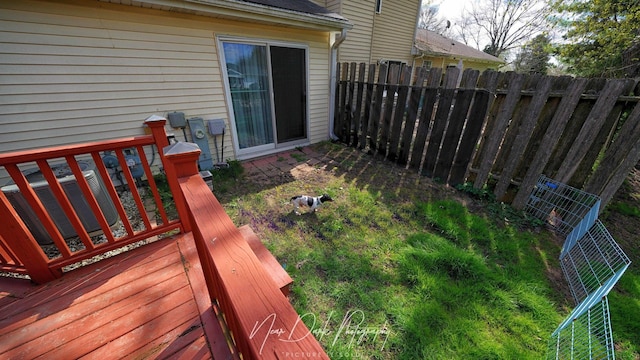 view of yard featuring fence and a deck