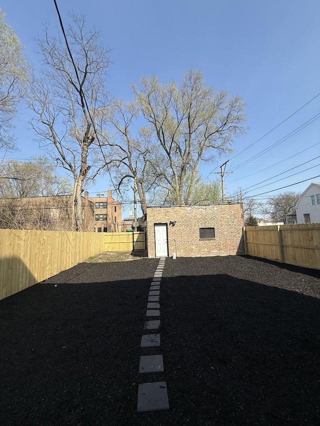 view of yard with a fenced backyard