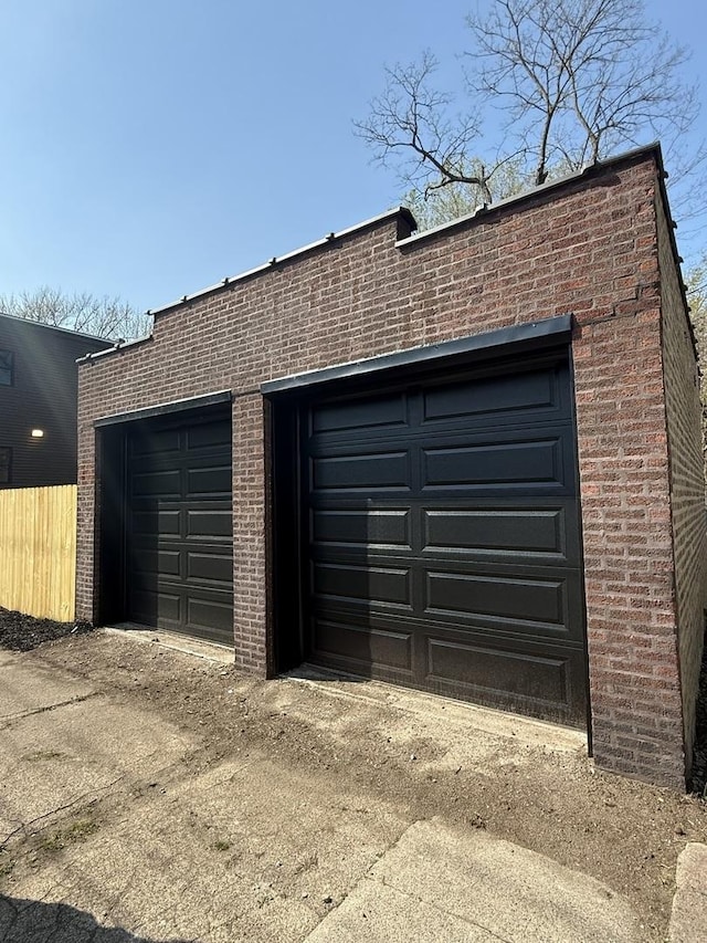 garage featuring fence