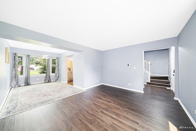 2860 Bridgeport Ln, Aurora, IL 60504 - unfurnished living room with dark wood-style floors and stairway