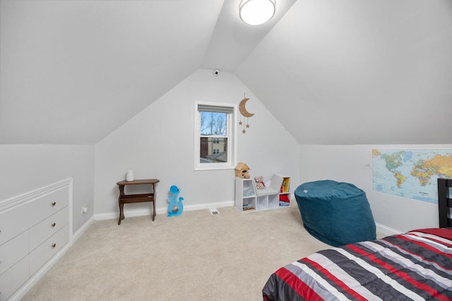 carpeted bedroom featuring vaulted ceiling