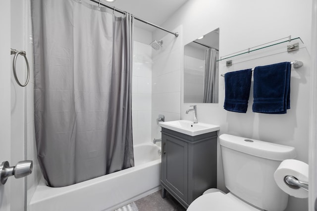 bathroom with vanity, toilet, and shower / bath combo with shower curtain