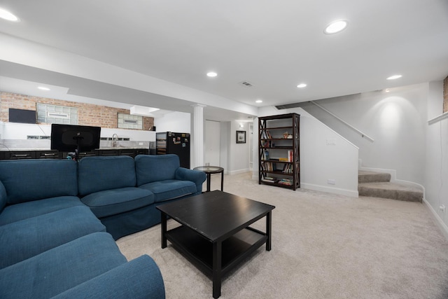 living room with light carpet, recessed lighting, baseboards, visible vents, and stairway