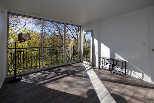 unfurnished sunroom with visible vents