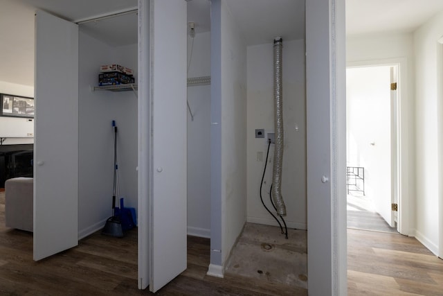 hall featuring wood finished floors and baseboards