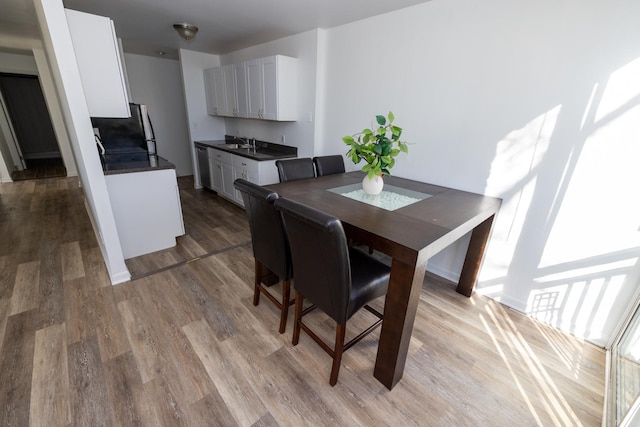 dining space featuring light wood finished floors