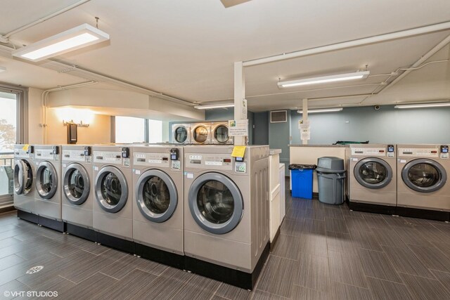community laundry room with independent washer and dryer