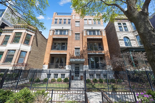 view of building exterior featuring a fenced front yard