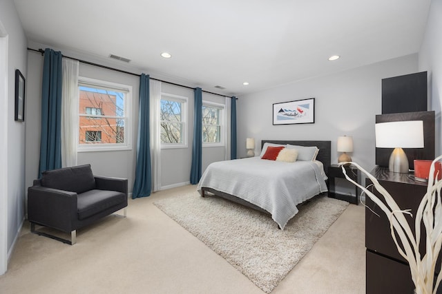 bedroom with baseboards, light carpet, recessed lighting, and visible vents