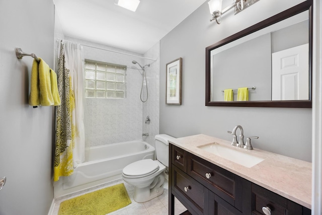 bathroom with toilet,  shower combination, tile patterned floors, and vanity