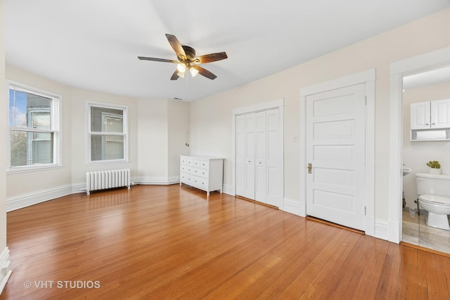 309 Wesley Ave, Oak Park, IL 60302 - unfurnished bedroom with ensuite bath, light wood-style floors, a closet, radiator heating unit, and baseboards
