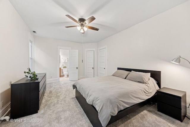 309 Wesley Ave, Oak Park, IL 60302 - bedroom with light colored carpet, visible vents, baseboards, a ceiling fan, and ensuite bath