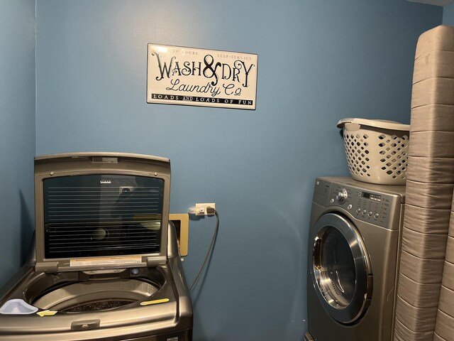laundry room featuring washer / clothes dryer and laundry area