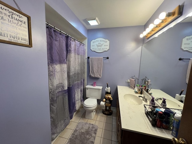full bathroom featuring vanity, tile patterned flooring, and toilet