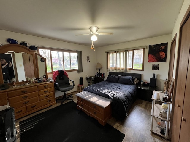 bedroom with a ceiling fan and wood finished floors