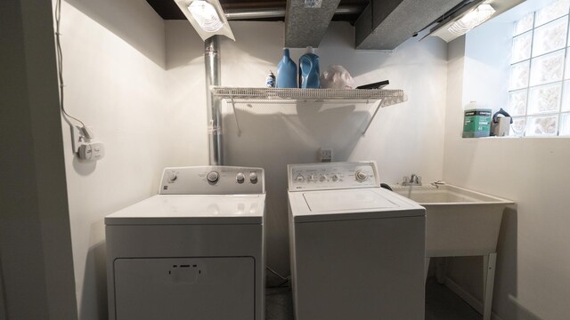 washroom featuring laundry area and washer and clothes dryer