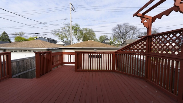wooden terrace with an outbuilding