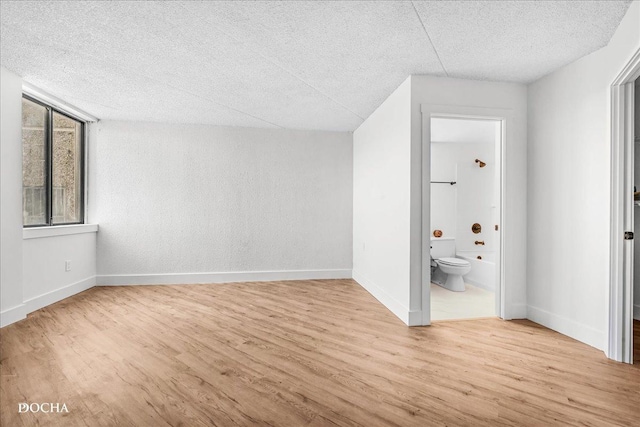 1750 N Marywood Ave Unit 501, Aurora, IL 60505 - interior space featuring a textured ceiling, baseboards, and wood finished floors