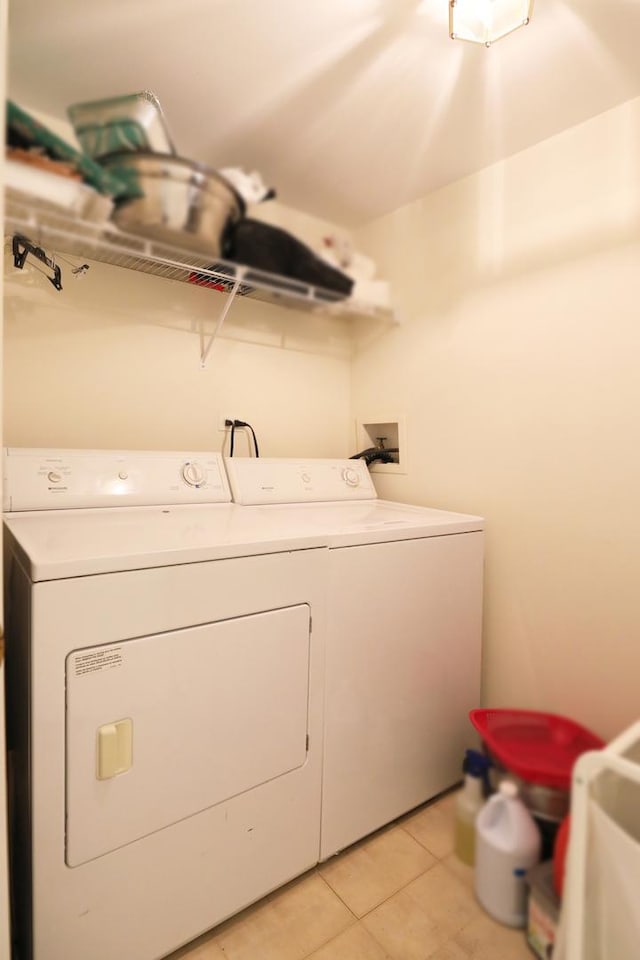 4566 Concord Ln, Northbrook, IL 60062 - washroom with washer and dryer and light tile patterned floors