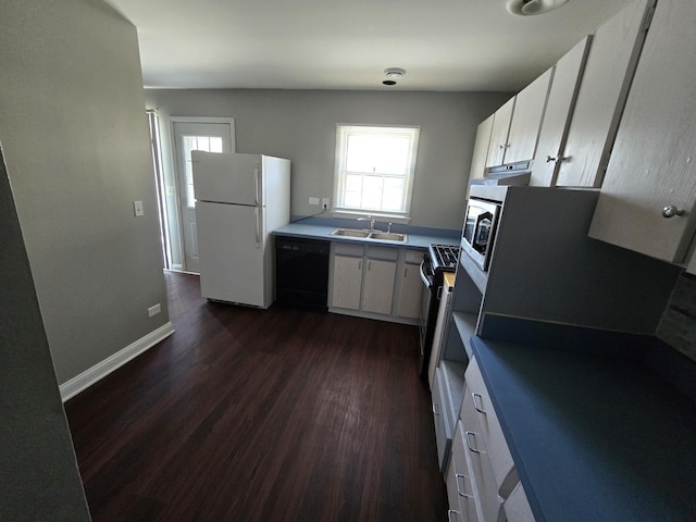 15016 S Holiday Ct, Orland Park, IL 60462 - kitchen with freestanding refrigerator, dishwasher, a sink, dark wood finished floors, and white cabinetry
