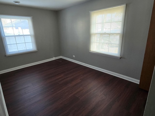 15016 S Holiday Ct, Orland Park, IL 60462 - empty room featuring dark wood-style flooring and baseboards