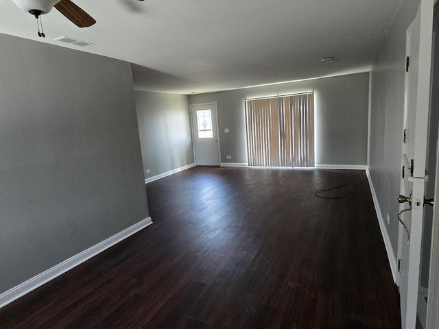 15016 S Holiday Ct, Orland Park, IL 60462 - empty room with dark wood finished floors, baseboards, and a ceiling fan