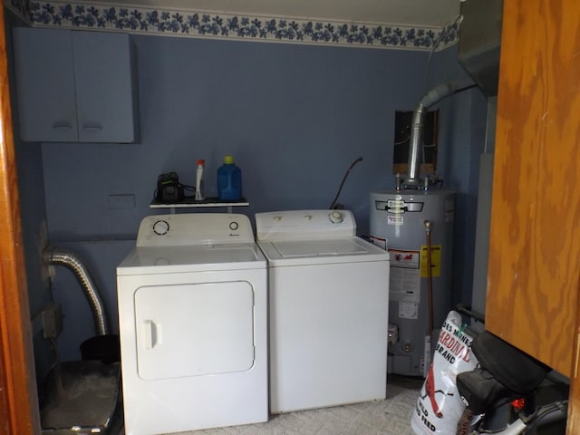 clothes washing area featuring gas water heater, laundry area, and independent washer and dryer