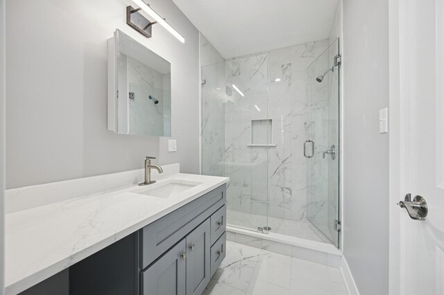 3141 Harvey Ave, Berwyn, IL 60402 - bathroom with a marble finish shower, baseboards, vanity, and marble finish floor