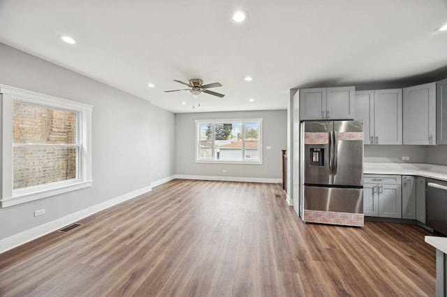 3141 Harvey Ave, Berwyn, IL 60402 - kitchen featuring stainless steel appliances, ceiling fan, gray cabinets, and wood finished floors