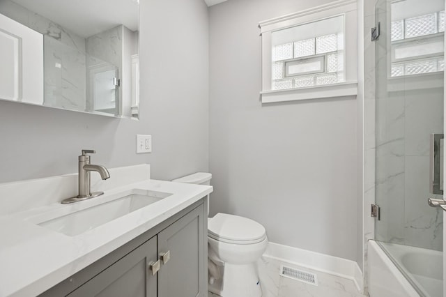 3141 Harvey Ave, Berwyn, IL 60402 - bathroom with vanity, toilet, enclosed tub / shower combo, marble finish floor, and visible vents