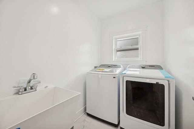 3141 Harvey Ave, Berwyn, IL 60402 - clothes washing area featuring laundry area, washing machine and dryer, a sink, baseboards, and marble finish floor