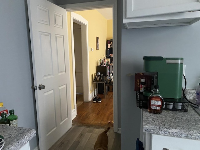 corridor with dark wood-type flooring