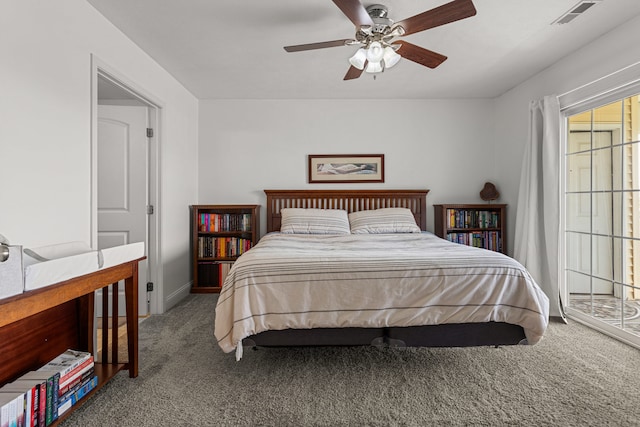 bedroom with carpet floors, baseboards, visible vents, and ceiling fan