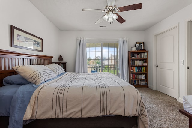 carpeted bedroom with ceiling fan and visible vents