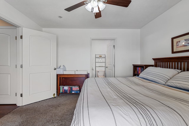 carpeted bedroom featuring ensuite bathroom and ceiling fan