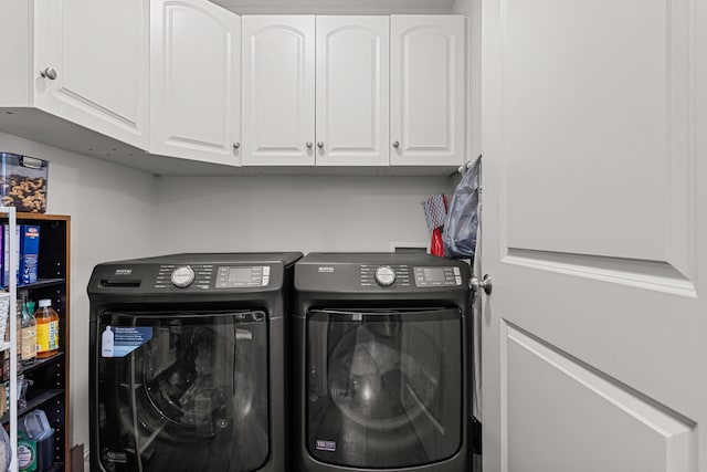 laundry area featuring cabinet space and independent washer and dryer