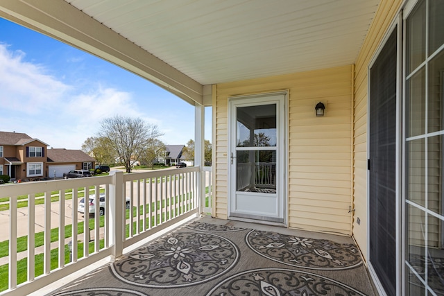 balcony with a residential view and a porch