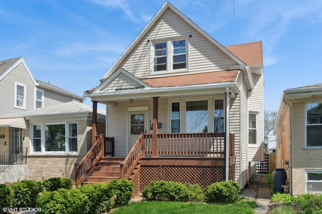 bungalow with a porch and stairs