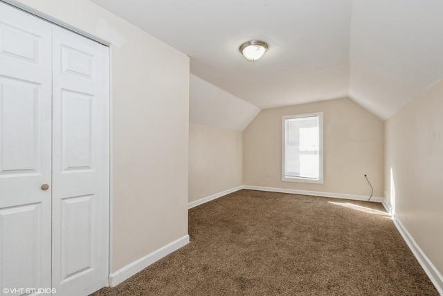 bonus room with carpet flooring, vaulted ceiling, and baseboards