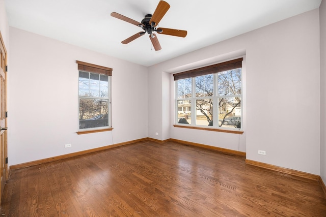 11253 Victoria Ln, Huntley, IL 60142 - unfurnished room featuring baseboards, a ceiling fan, wood finished floors, and a healthy amount of sunlight