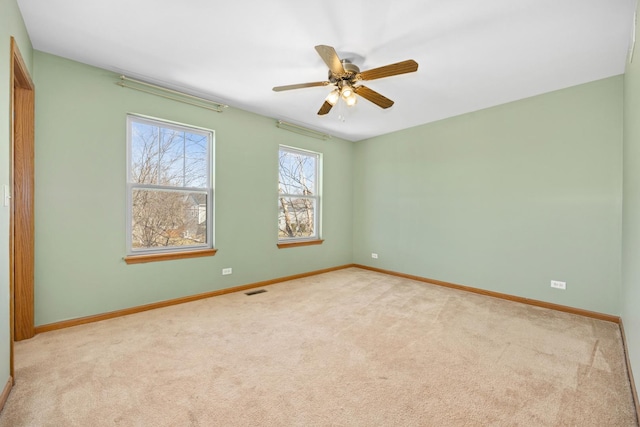 11253 Victoria Ln, Huntley, IL 60142 - spare room with visible vents, ceiling fan, baseboards, and carpet floors