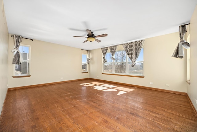 11253 Victoria Ln, Huntley, IL 60142 - unfurnished room featuring wood finished floors, a healthy amount of sunlight, and baseboards