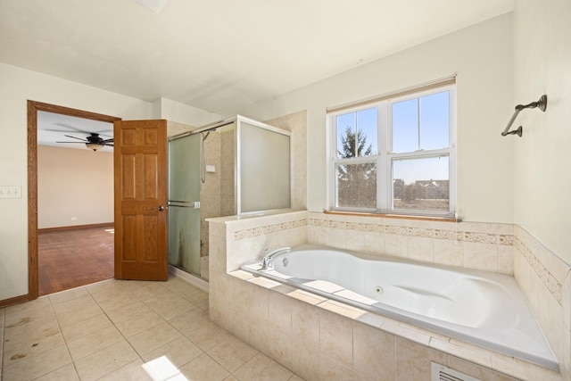 11253 Victoria Ln, Huntley, IL 60142 - bathroom featuring a stall shower, a ceiling fan, tile patterned flooring, and a jetted tub