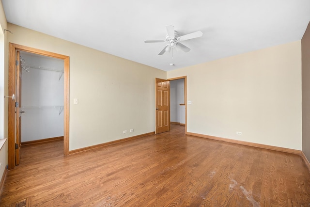 11253 Victoria Ln, Huntley, IL 60142 - unfurnished room with baseboards, wood finished floors, and a ceiling fan