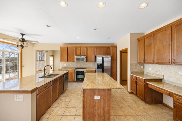 11253 Victoria Ln, Huntley, IL 60142 - kitchen with tasteful backsplash, an island with sink, a sink, and stainless steel appliances