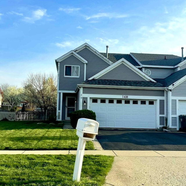 1410 Timber Ln, South Elgin, IL 60177 - traditional home with fence, aphalt driveway, a shingled roof, a front yard, and an attached garage