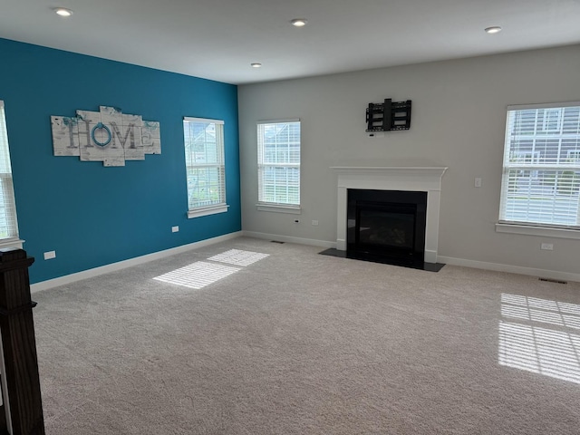 1840 Tall Oaks Dr, Antioch, IL 60002 - unfurnished living room with carpet, baseboards, a fireplace with flush hearth, and recessed lighting
