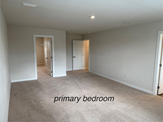 1840 Tall Oaks Dr, Antioch, IL 60002 - unfurnished bedroom featuring carpet floors, baseboards, a walk in closet, and a closet